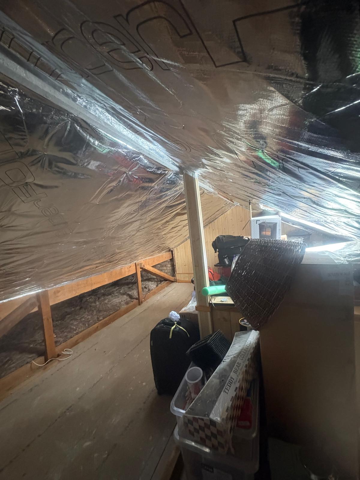 Boarded loft finished beneath SuperFoil multifoil layer